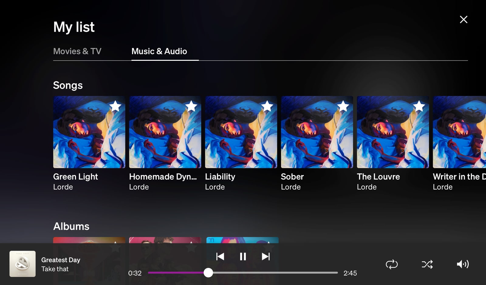 Favourites showing Music & Audio choices and the media player controls visibly playing a song.